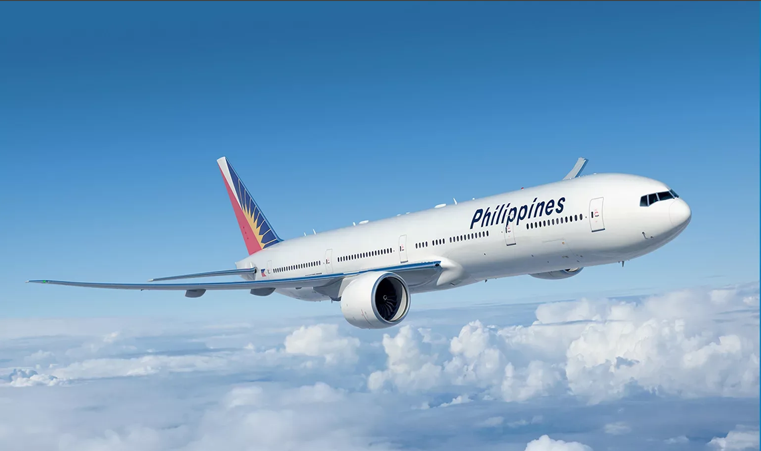 Philippine Airlines aircraft climbing above the clouds